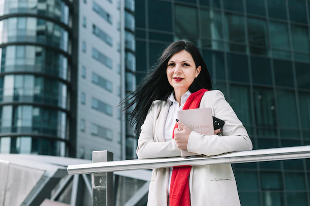 Portrait Businesswoman Holding Diary Cellphone With Building Background 23 2147970914